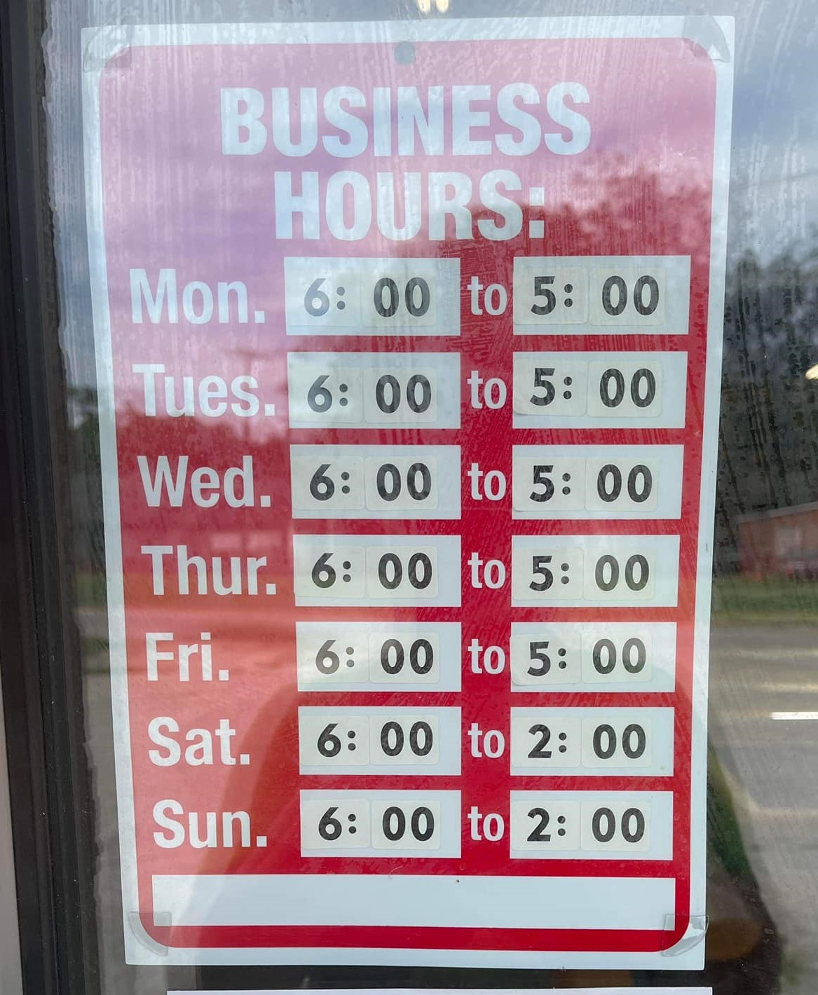 store hours in store window